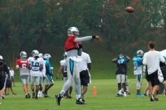 Cam Newton warms up.